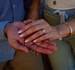 Engagement ring on a newly engaged woman’s hand after a surprise proposal during a Joshua Tree engagement photography session.