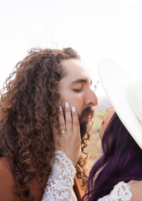 Bride about to kiss groom. Wedding at Cap Rock in Joshua Tree National Park. Photo by Joshua Tree Wedding Photographer Sarah Nicole Photo.