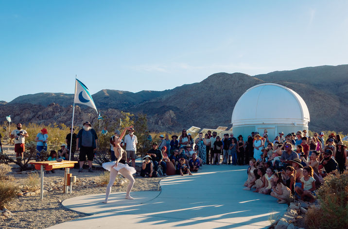 Artistic lighting highlights dancers' poses during Dance Mojave’s The Planets in the High Desert.