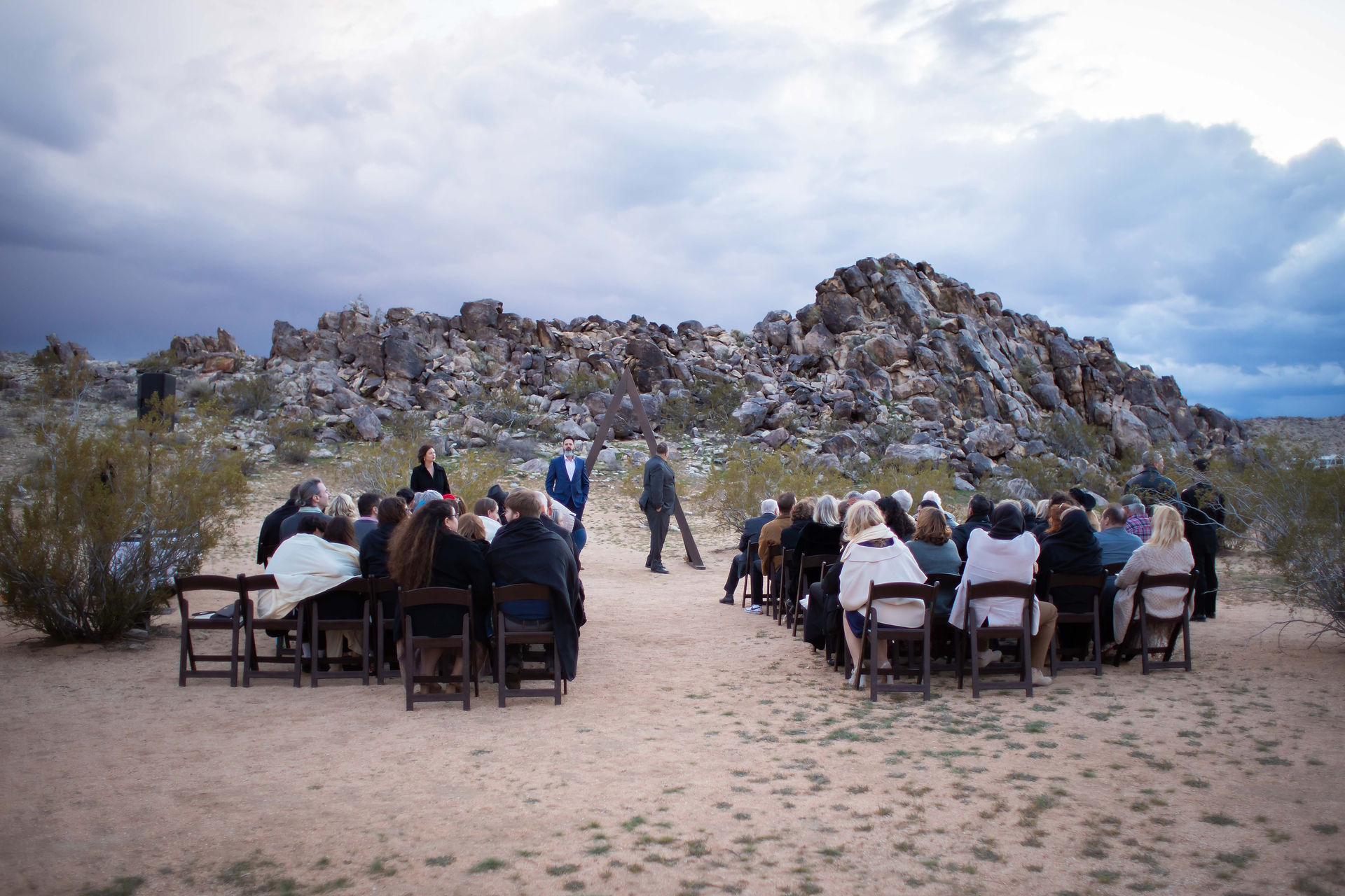 Couple exchanging vows at The Morada. Photo by Joshua Tree Wedding Photographer Sarah Nicole Photo.