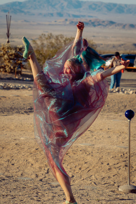 Dynamic motion blur effect on dancers in The Planets performance, Joshua Tree photographer.