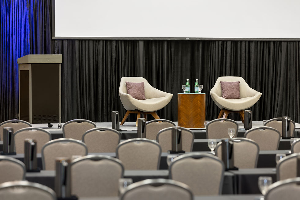 Chairs set up in the ballroom facing the stage