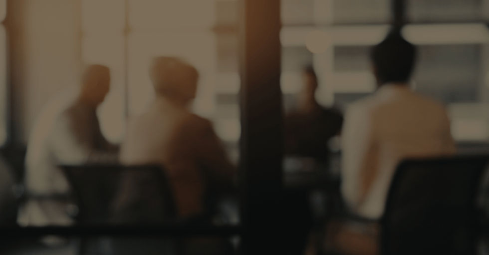 executives in meeting room with blur effect