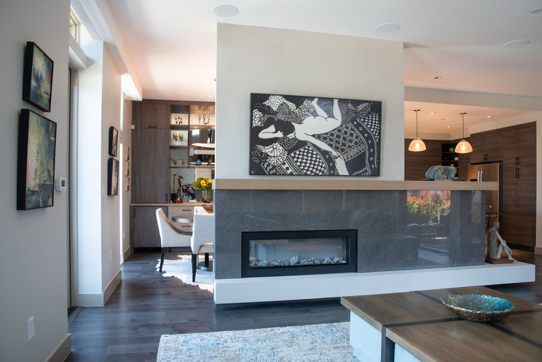 Denver living space featuring custom bar and display cabinetry with built-in shelving, built and installed by VOGO Cabinets