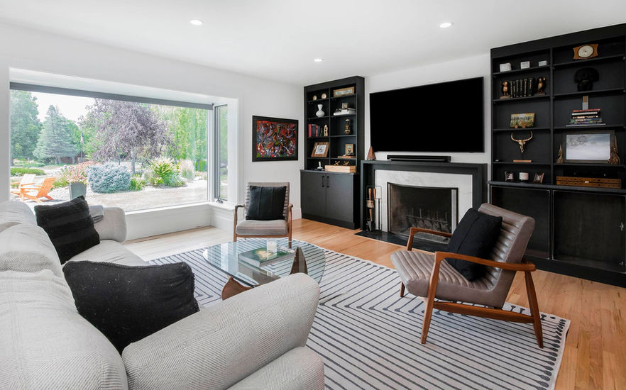 Denver living room with VOGO Cabinets custom built-ins, open shelving, and storage surrounding a fireplace and TV