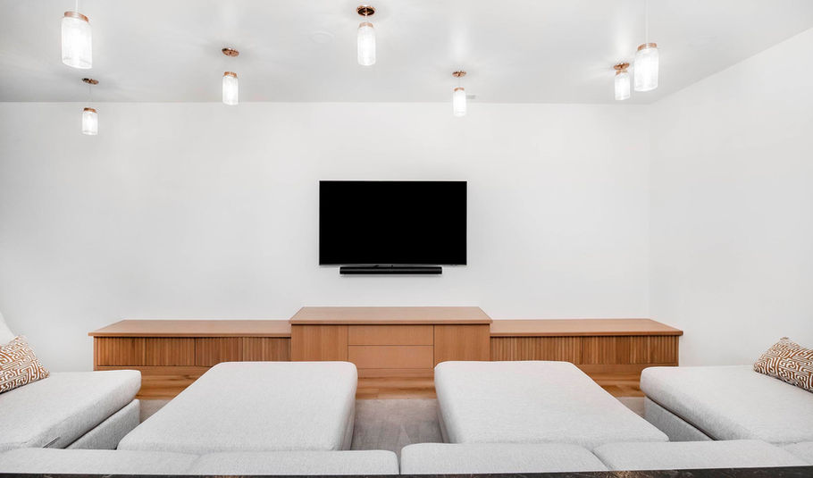 VOGO Cabinets custom built-in cabinets with ribbed, natural wood doors inside a Denver living room