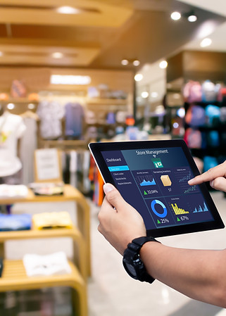 smart-store-management-systems-conceptmanager-using-digital-tablet-blurred-store-as-backgr