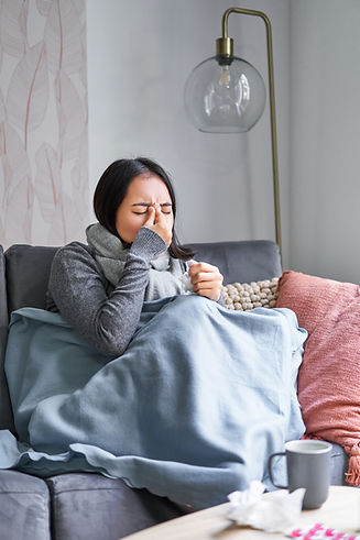 woman-with-temperature-coughing-showing-symptoms-flu-influenza-cold-sitting-warm-clothes.j