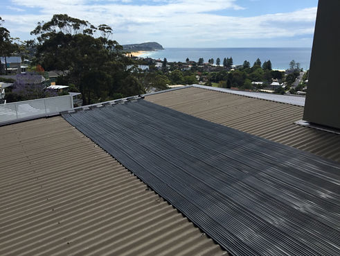 Sunlover strip solar heating system fitted on a residential roof
