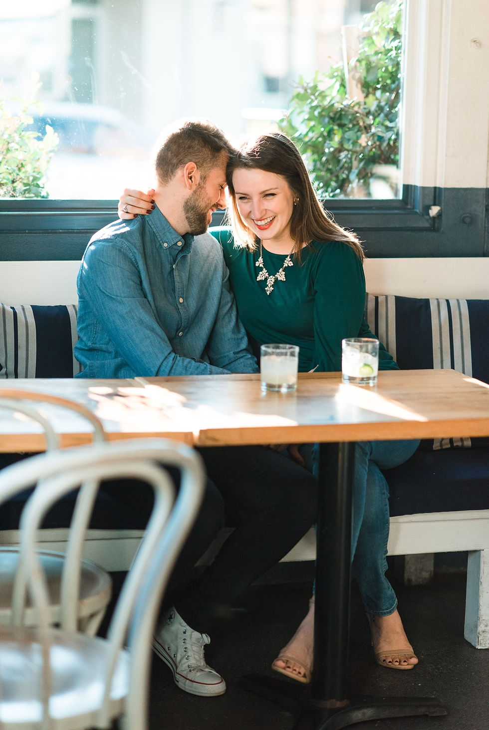 engagement session at westside provisions atlanta woman wearing yellow skirt and guy wearing maroon jeans