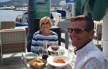 Todd and Rhonda Eating Dinner with Harbor View in Background.jpg