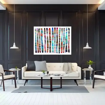 Large, rectangular, multi-colored, multi-directional striped, abstract art piece (with a white background), hanging above a white couch on a black, paneled wall.