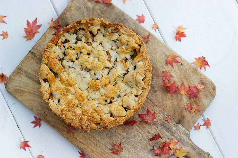 crumbled-cake-with-read-leaves-on-wooden-cutting-board