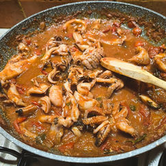 Cuttlefish in Datterini sauce with Polenta