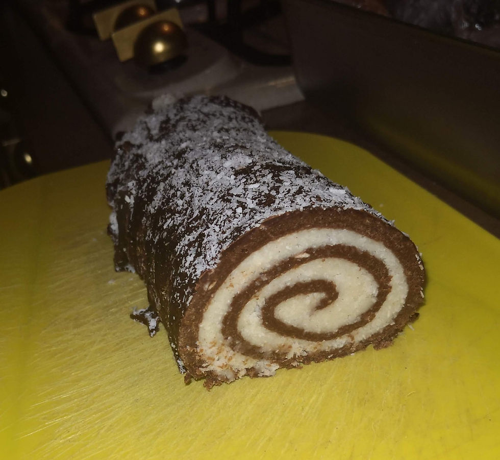 coconut-chocolate-roll-dessert-on-yellow-cutting-board