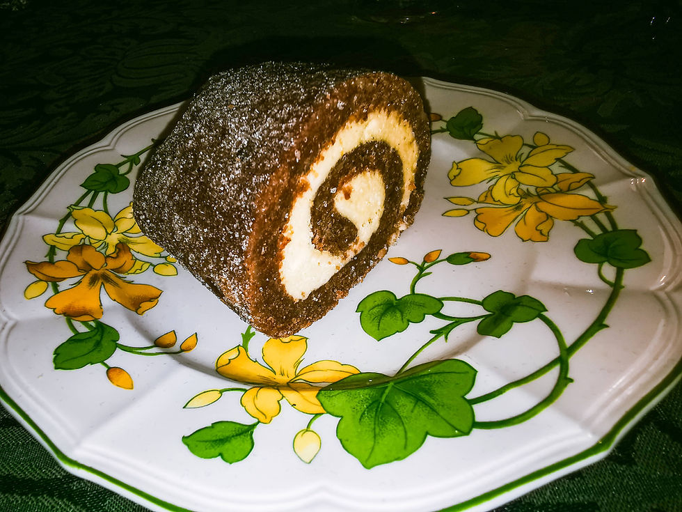 walnut-roll-dessert-on-decorative-plate