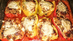 Filled Peppers In Tomato Sauce with Mozzarella and Parmesan in Oven
