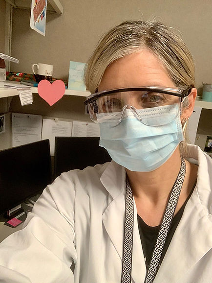 Rhonda Nichol in surgical face mask at her work as a nurse.
