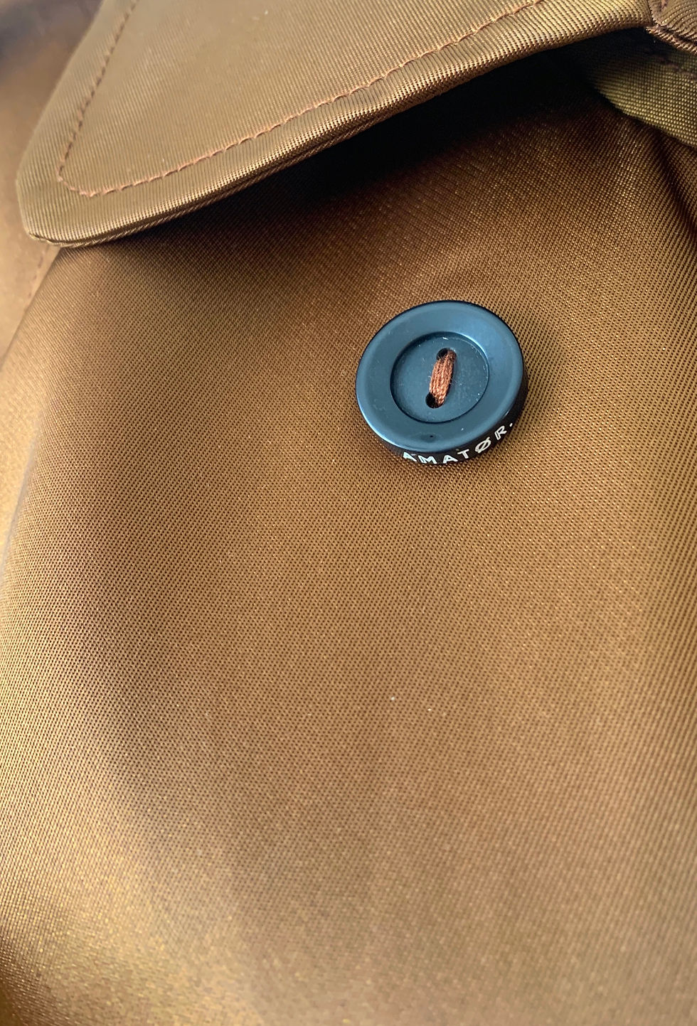 Thumbnail: Full length belted bronze trench coat by Amatør