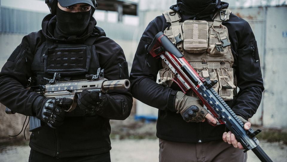 The Sovran SB-5 Bullpup offers unmatched control in close-quarters situations, shown here in a forward-ready stance.