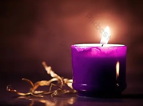 burning-candle-purple-on-a-dark-background_9591743.webp
