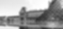Black and white photo of the Louvre in Paris, biosthétique logo place in white on bottom right corner