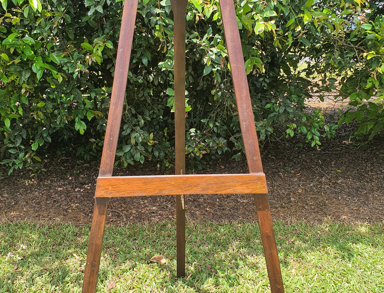 Large dark timber easel hire for weddings and events Cassowary Coast