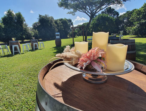 Wine barrel with candles and floral decor wedding display
