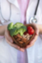 healthy-food-heart-diet-concept-doctor-holding-bowl-with-vegetables-nuts-chickpea.jpg