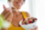 beautiful-young-woman-eating-cereals-fruits-home.jpg