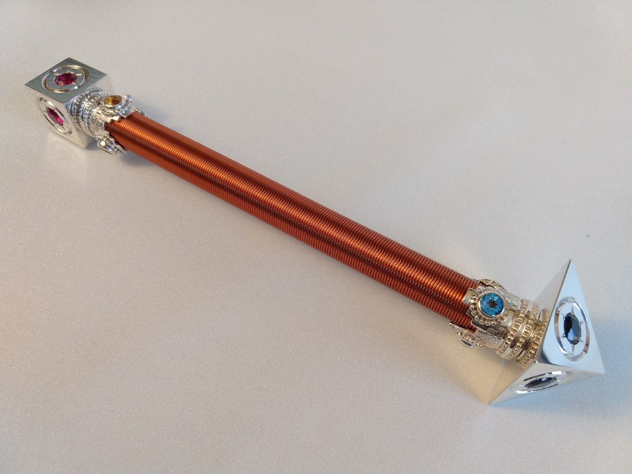 The Pyramid Sceptre in silver with Silver discs and cuffs detail