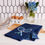 Thumbnail: Lifestyle pic of a navy blue tea towel with white repeating tennis racquets and blue and green tennis balls