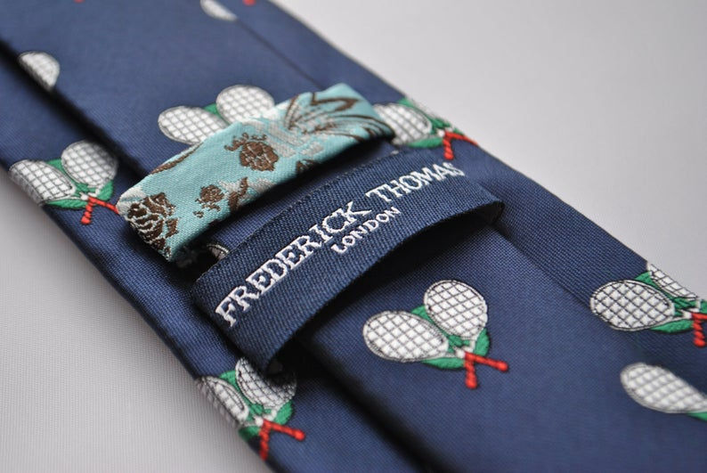 Thumbnail: Navy tie with repeating double crossed white tennis rackets
