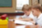 focused-on-their-studies-two-young-schoolboys-sit-2023-01-06-16-16-28-utc.jpg