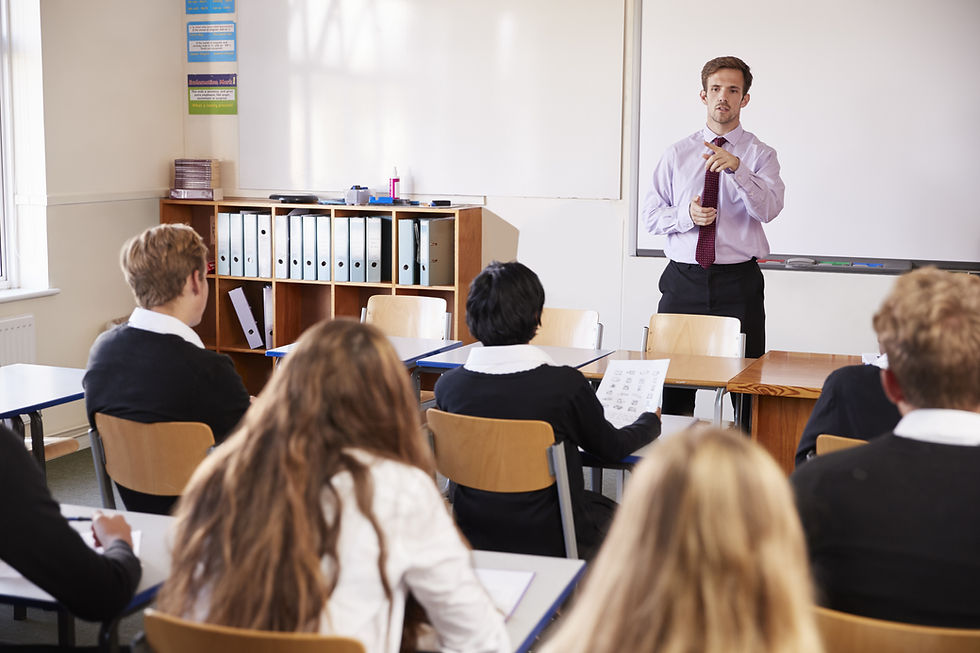 teenage-students-listening-to-male-teacher-in-clas-2021-08-26-16-13-37-utc.jpg