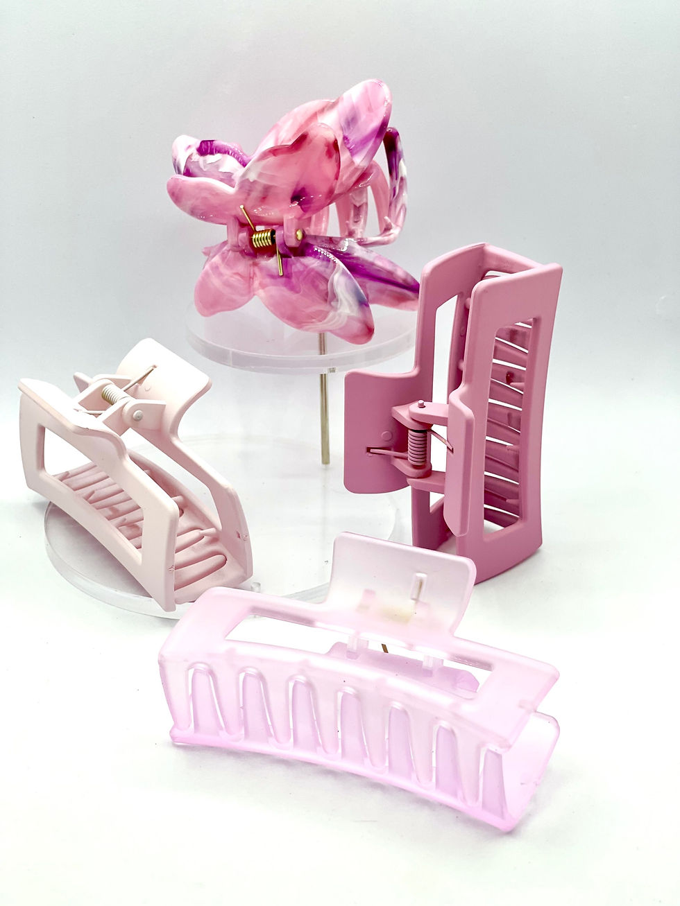 Thumbnail: "Pink Harmony Hair Claw Set: Butterfly and Hollow Square Designs in Various Pink