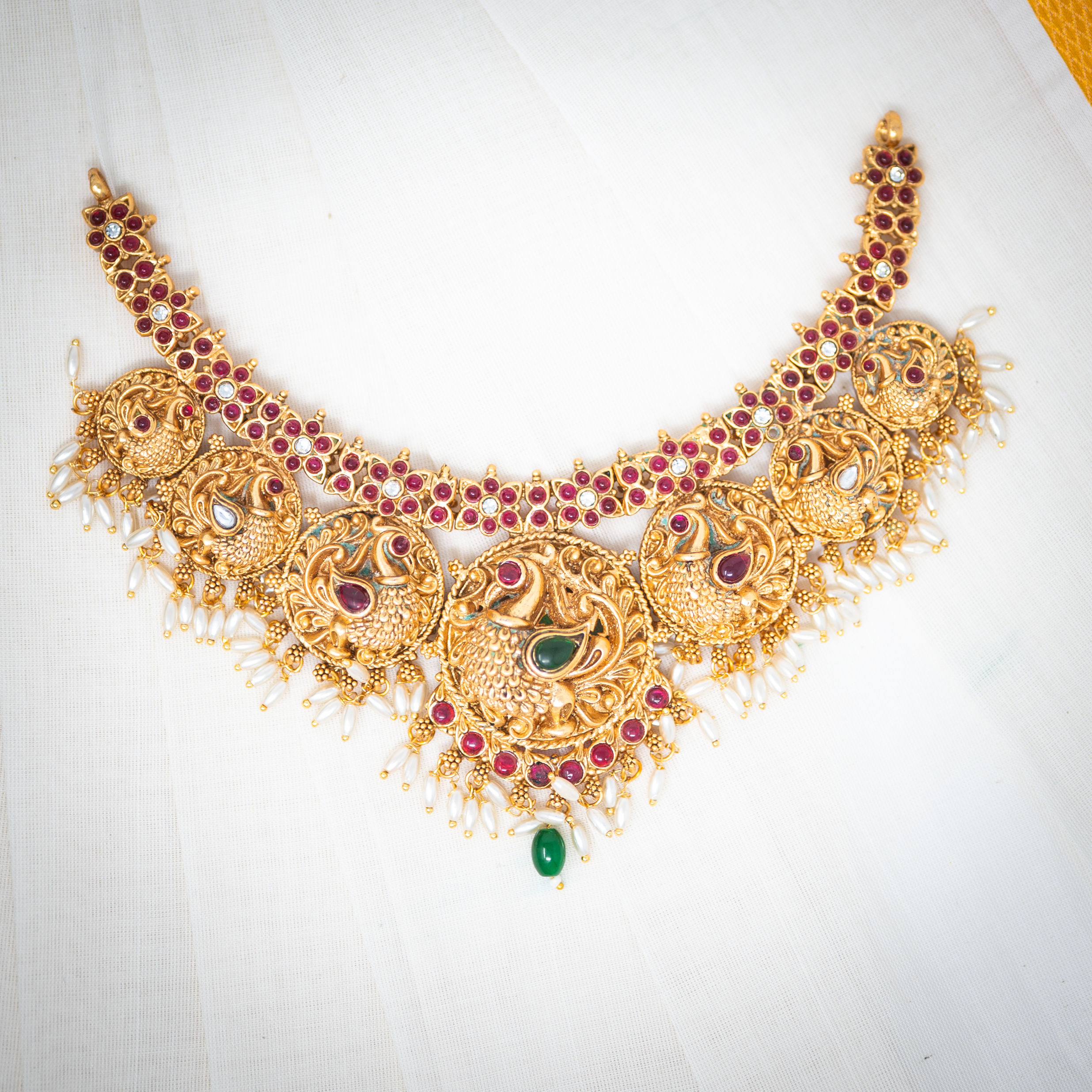 Peacock Adornment: Gold and Green Gemstone Masterpiece