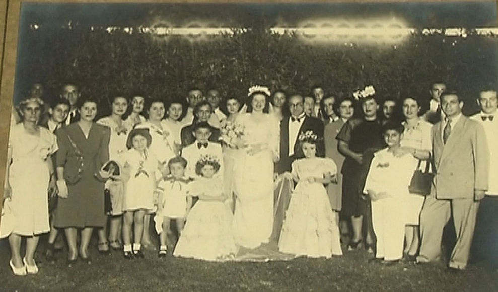 Aida Hakim: Aida, her husband with their extended families on their wedding day. Baghdad, 1947