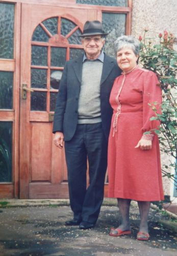 Yehezkel & Habiba Kojaman: Yehezkel & Habiba in front of their house. UK, 1985-1986
