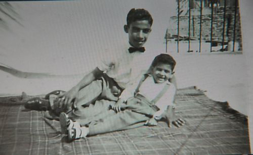 Yeshooa Samuel: Yeshooa and his brother Simon on the roof of their house. Aden, 1955-1956