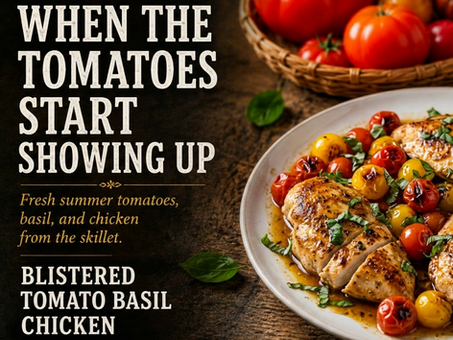 Hero image for a summer recipe titled When the Tomatoes Start Showing Up. A rustic wooden table holds a white plate of golden-seared chicken breast topped with blistered red and yellow tomatoes and fresh basil. Behind the plate sits a basket overflowing with ripe heirloom tomatoes. Editorial text highlights the recipe Blistered Tomato Basil Chicken featuring French Countryside seasoning and the Gentle Bloom (Light Oil Bloom) method.