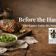 Rustic Easter table with herb-roasted lamb, fresh spring greens, and crusty bread on a wooden surface with soft natural light and open space for text