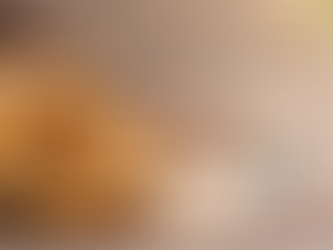 Golden braided Greek koulourakia cookies stacked on a rustic wooden table with sesame seeds, orange slices, and a cup of coffee in soft morning light, with space for text on the righ