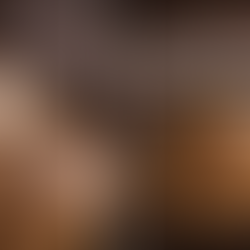 Whole roasted chicken in a cast iron pan with potatoes and carrots, with a fork lifting a tender, steaming bite against a rustic wooden background