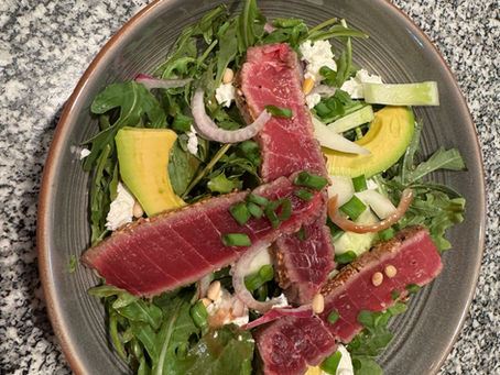 Seared Sesame & Black Pepper Crusted Tuna over Salad with Goat Cheese, Cucumber, Pine Nuts, Avocado & Red Onion