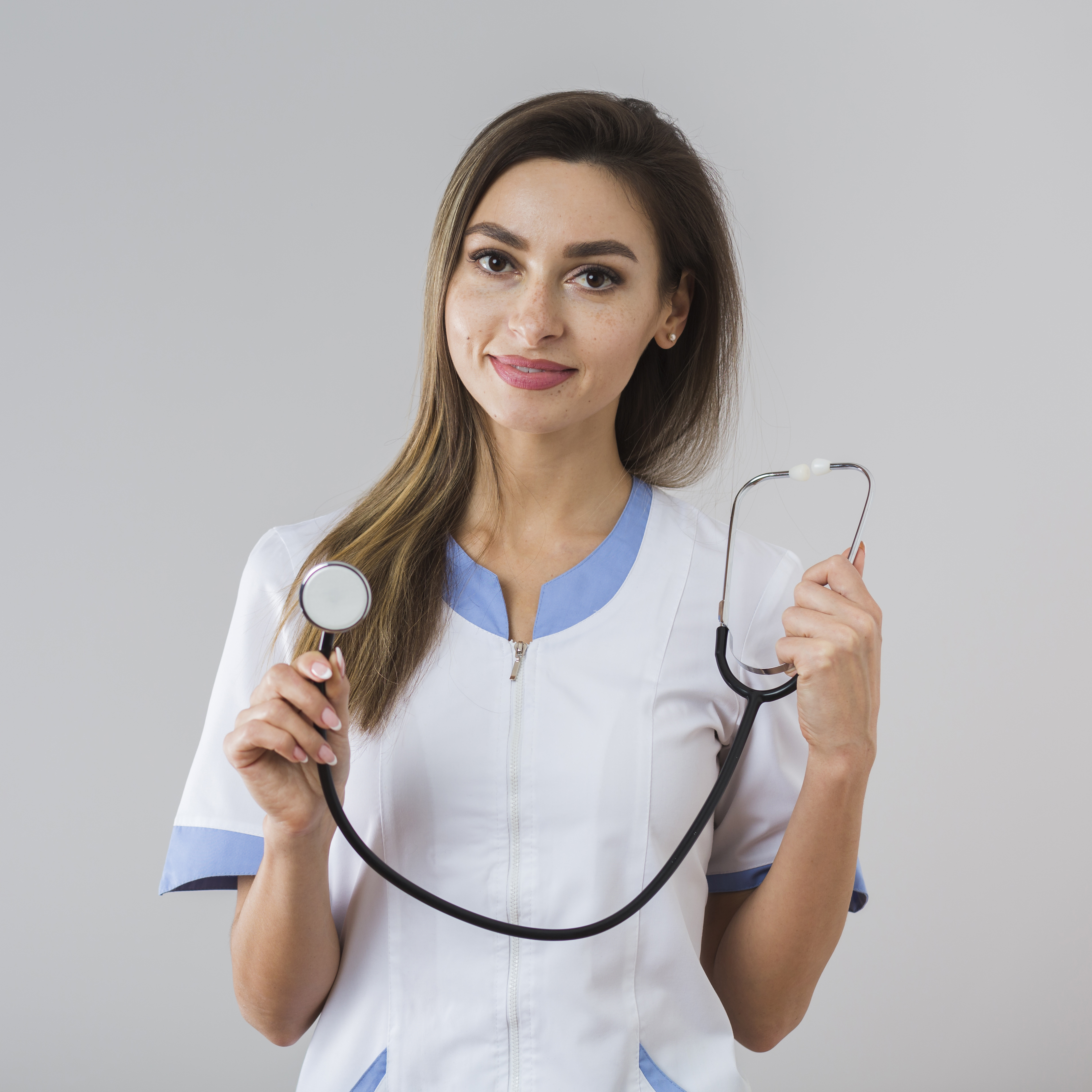 smiling-young-woman-holding-stethoscope.jpg