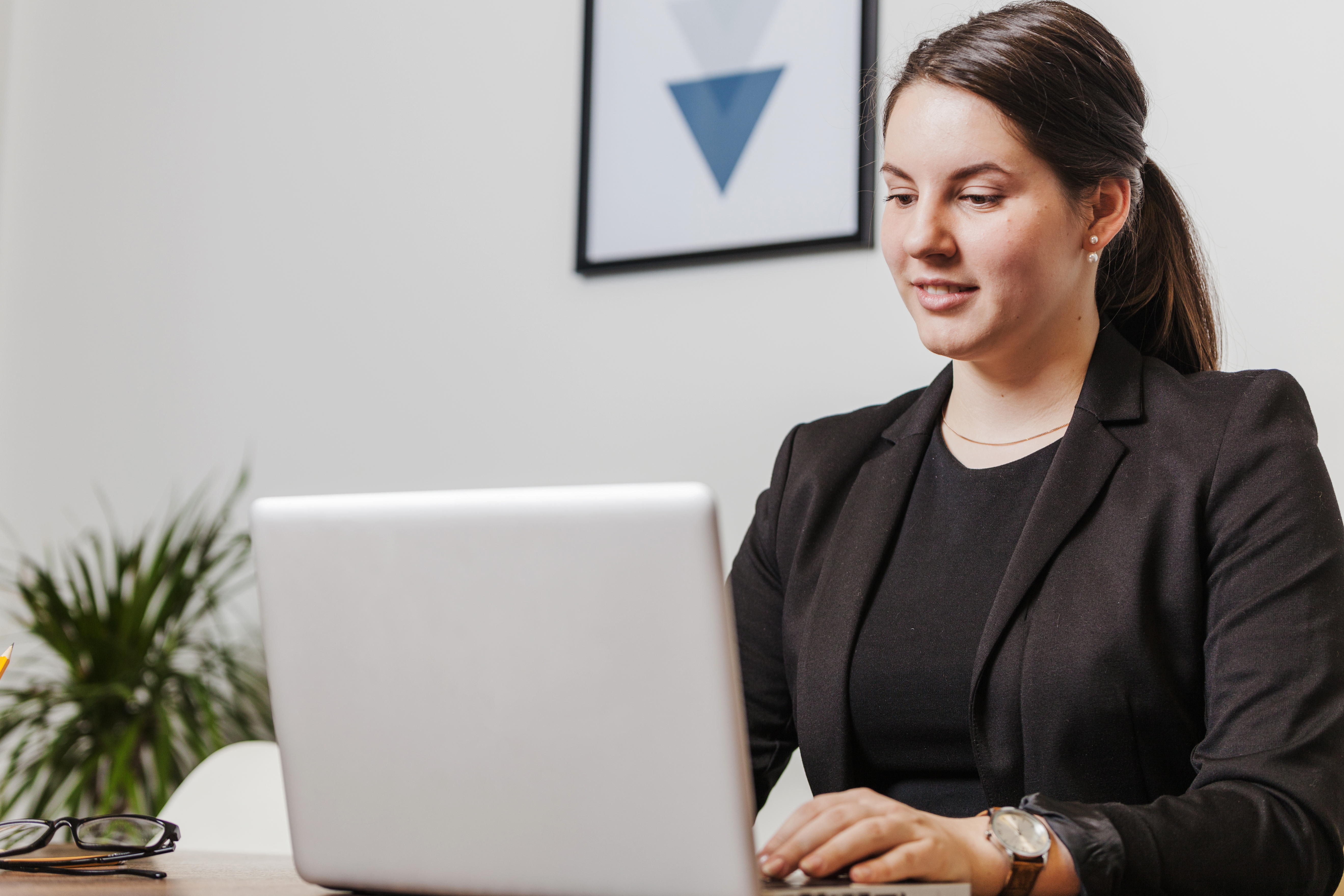 smiling-woman-laptop-office(1).jpg