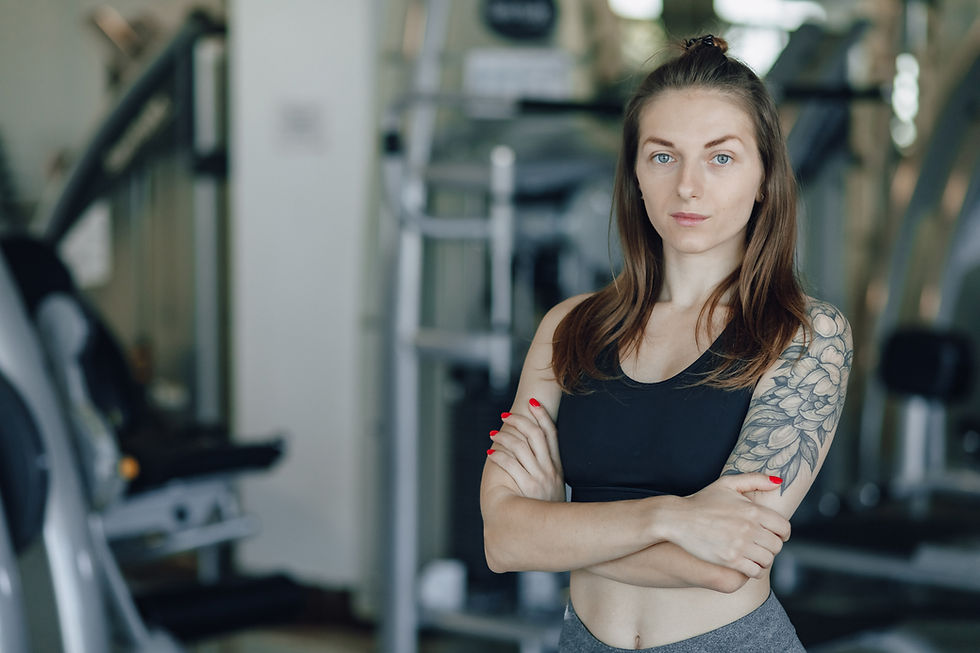 attractive-athletic-girl-stands-wall-simulators-gym-healthy-lifestyle.jpg