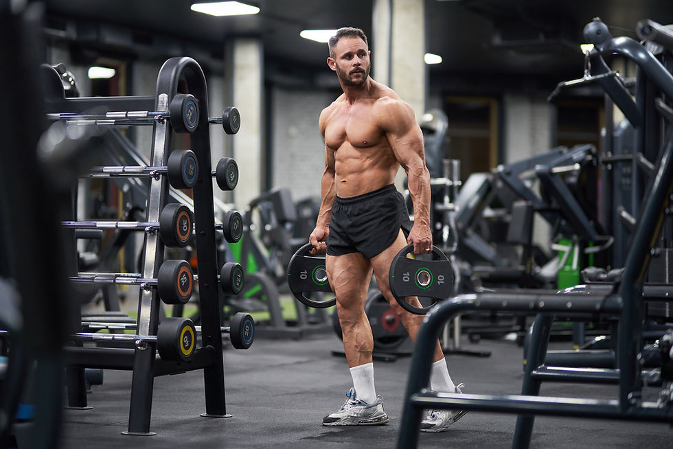 serious-sportsman-carrying-plates-barbell-gym.jpg