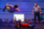 Wrestler Drew Hood, left, drops a flying elbow on Cam Jackson during an Apple City Championship Wrestling match on March 15, 2025.